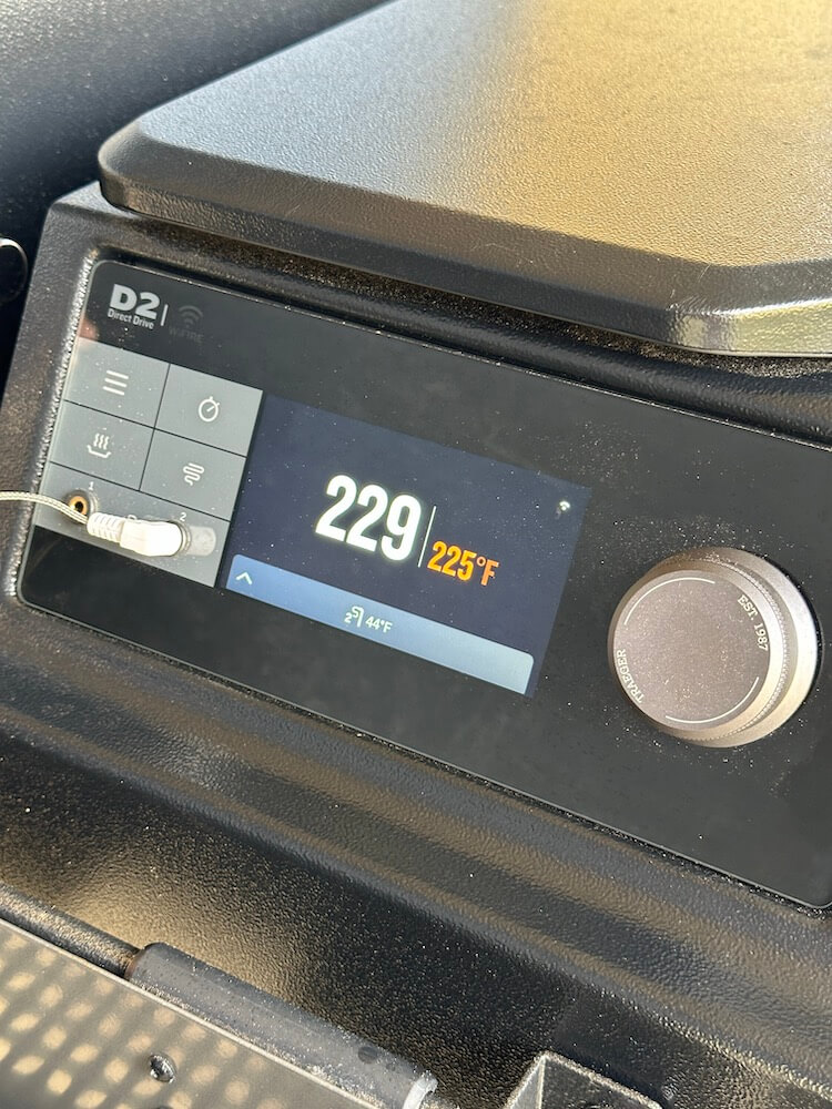 Traeger pellet grill temperature reading showing 225 degrees F