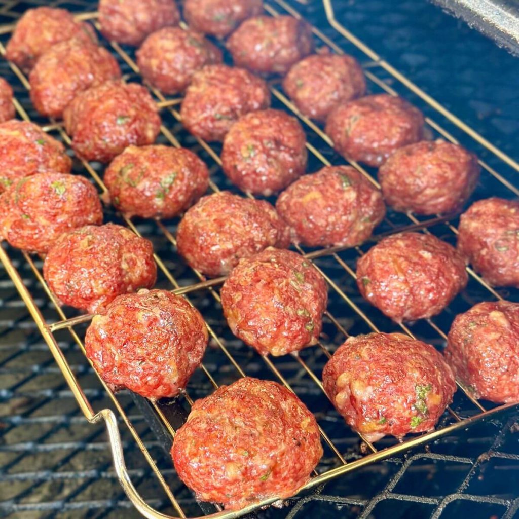 smoked Italian meatballs cooking on a pellet grill