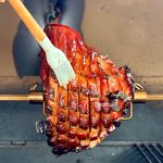 glazing a rotisserie ham with coca cola glaze
