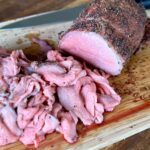 smoked eye of round roast sliced into thin slices