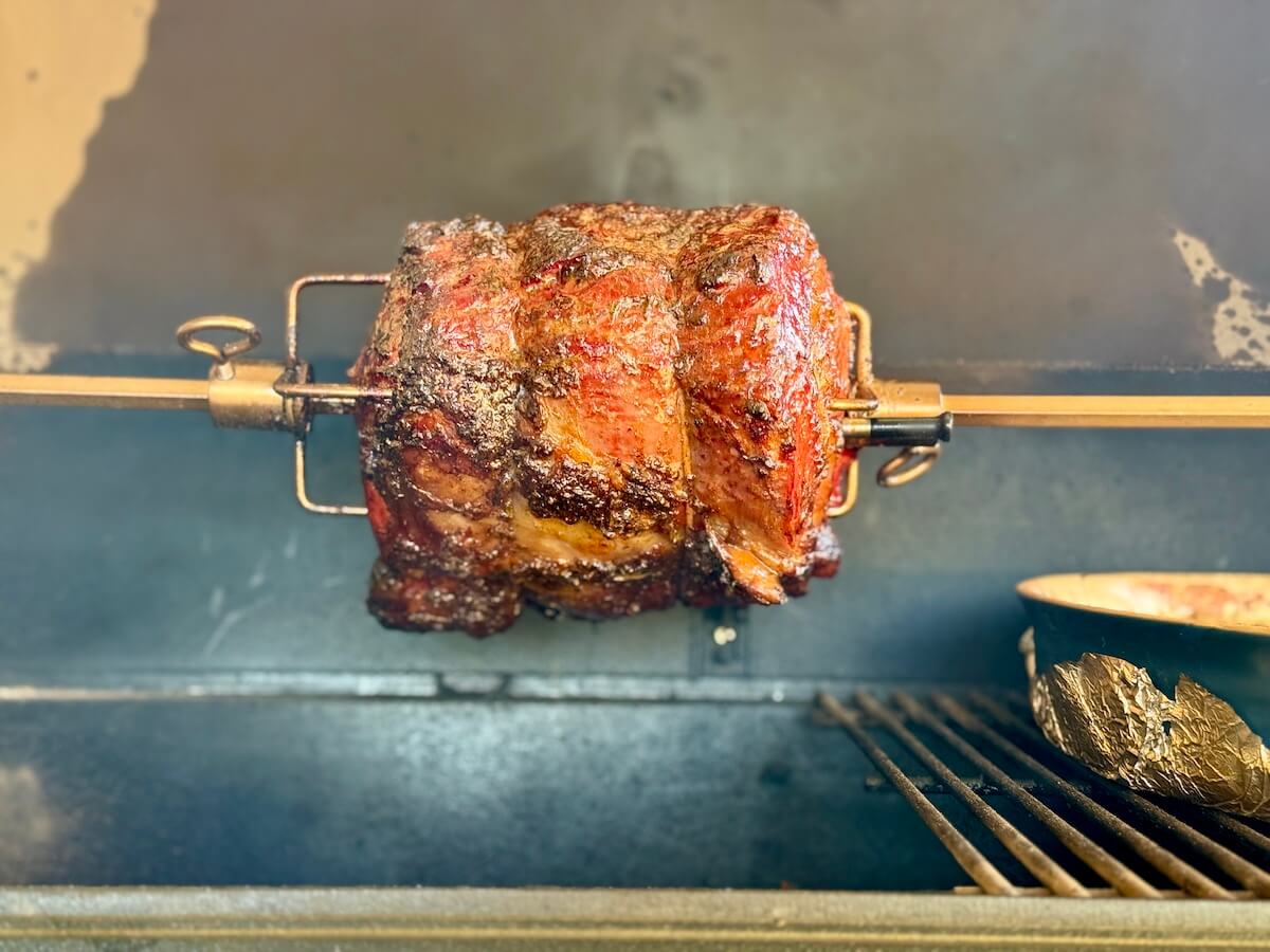 prime rib roast cooking on a rotisserie