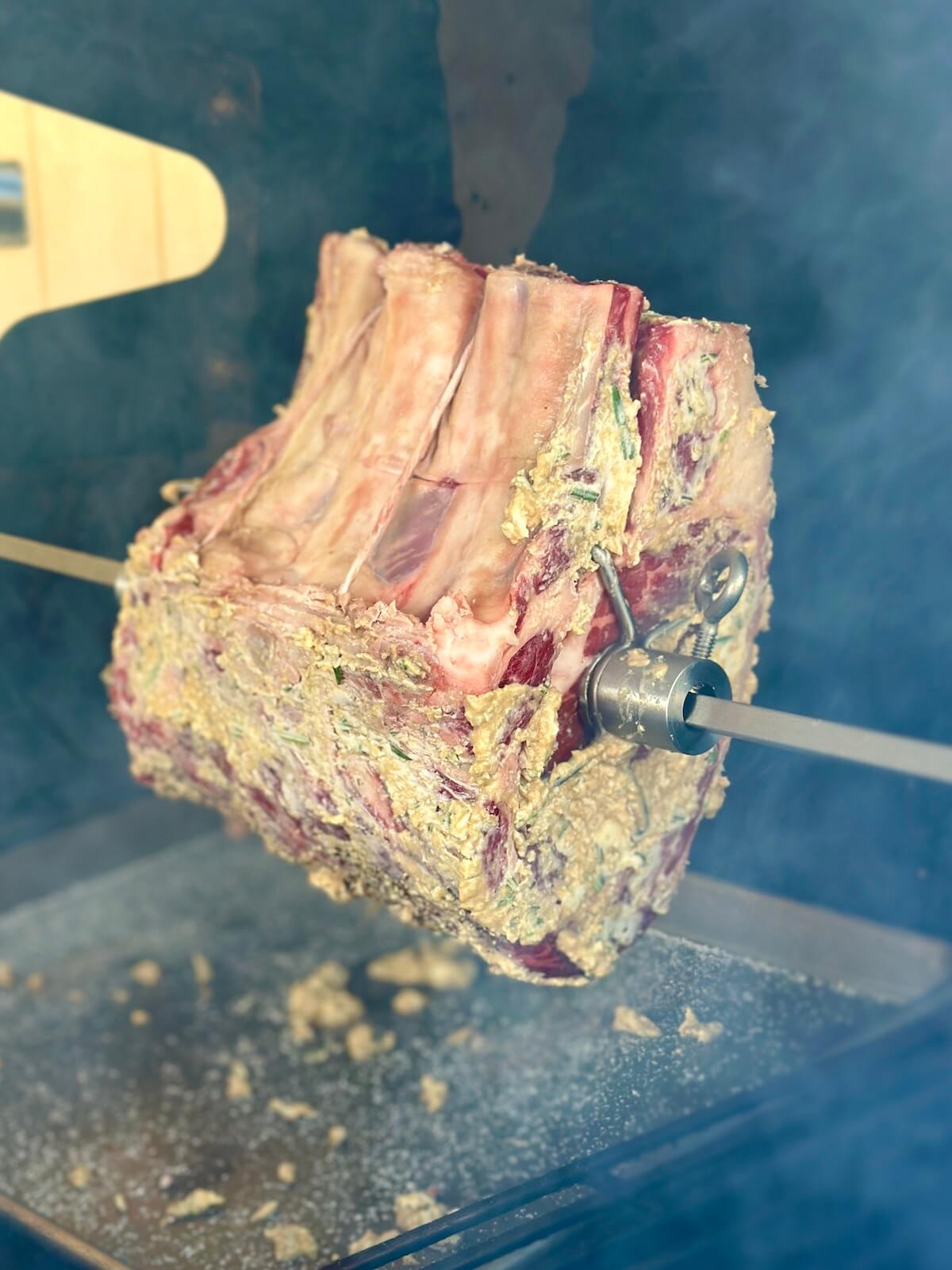 prime rib on a rotisserie grill attachment