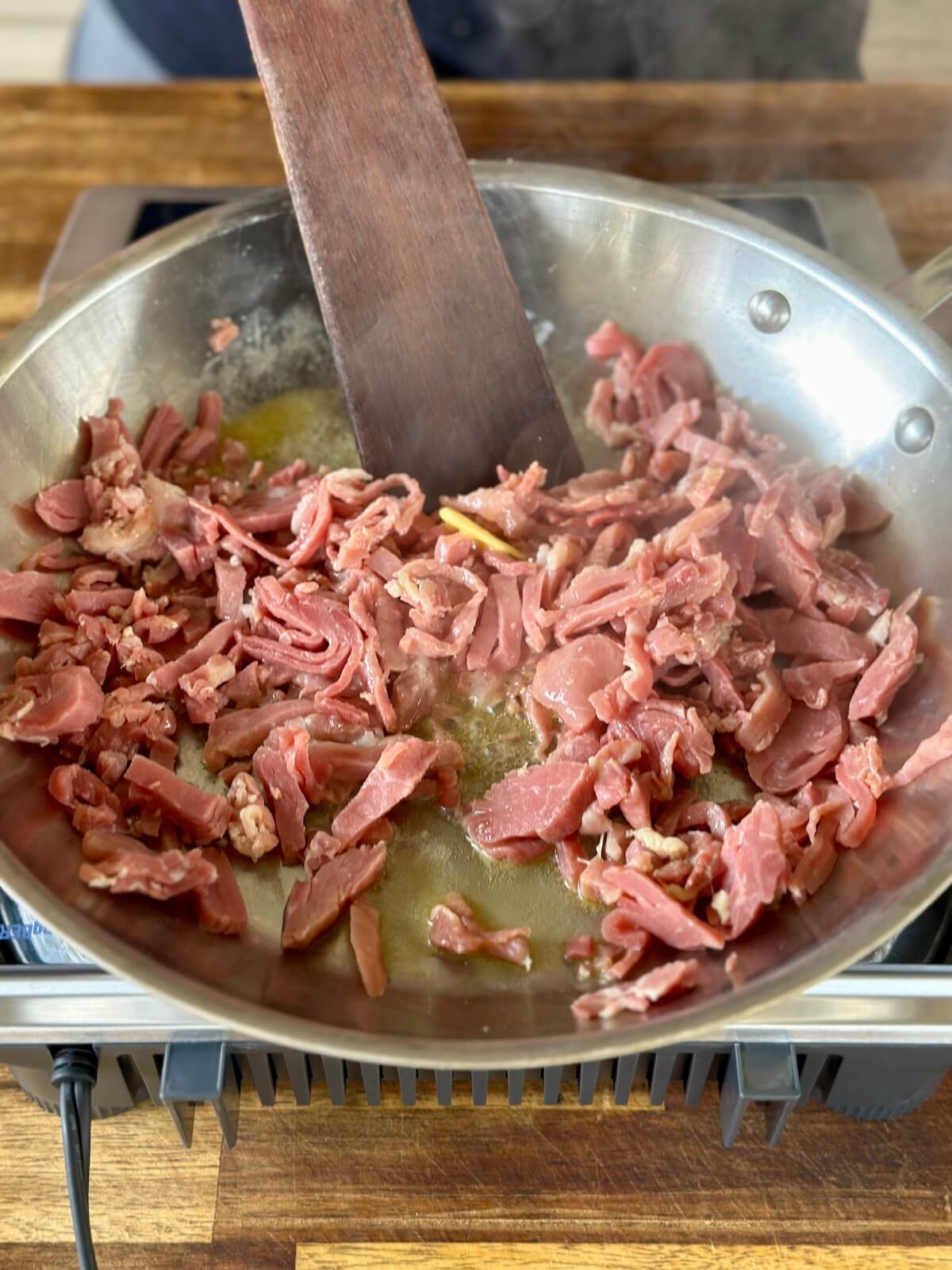 sautéing diced country ham in a skillet