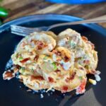 smoked scalloped potatoes with cheese and bacon