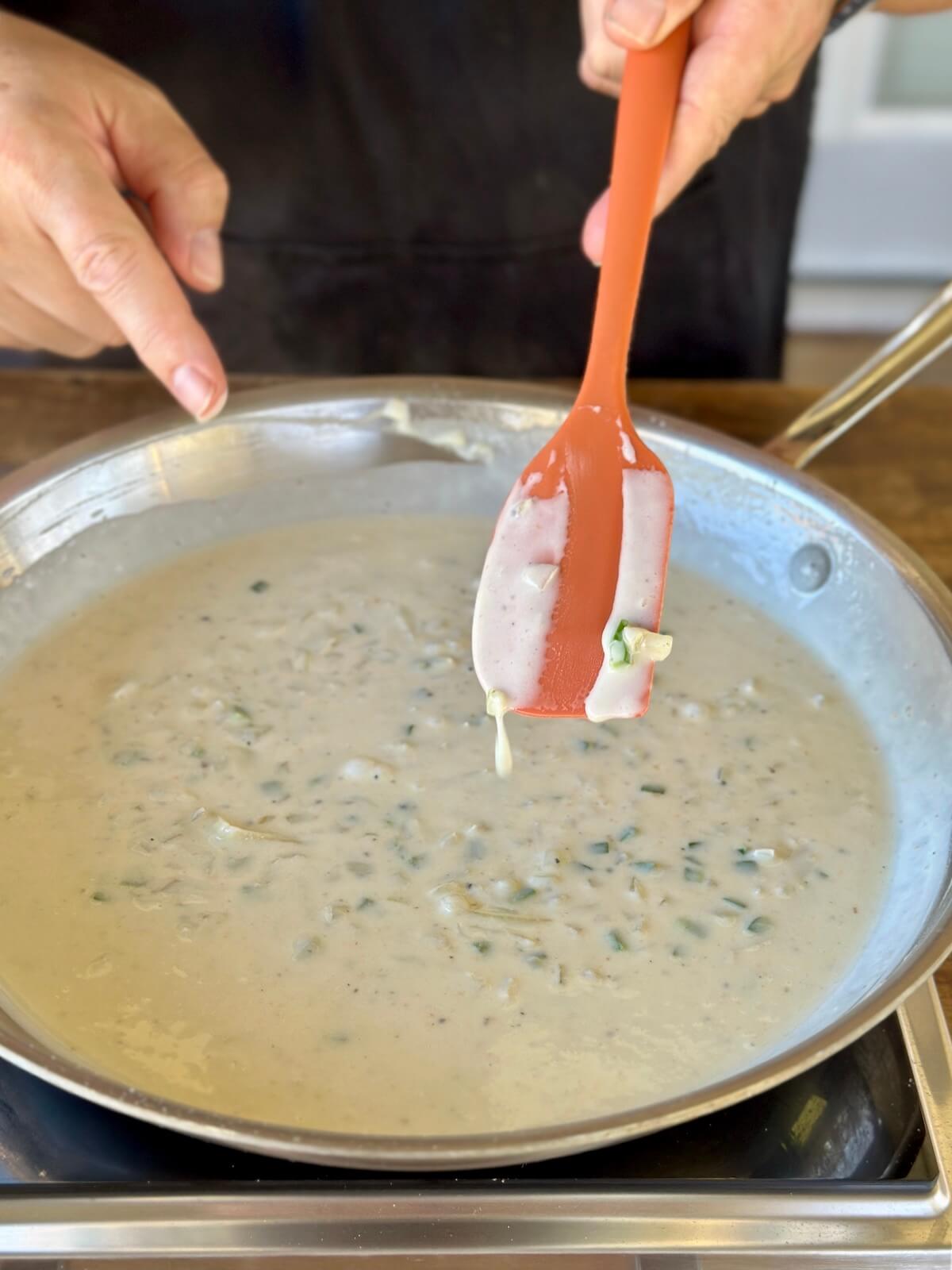 making a cream sauce in a skillet