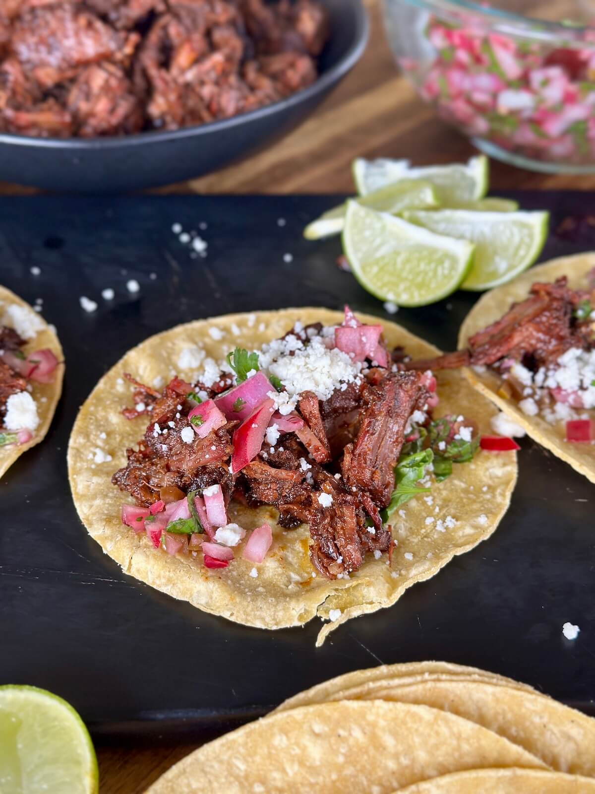 burnt end tacos with beef brisket in birria sauce