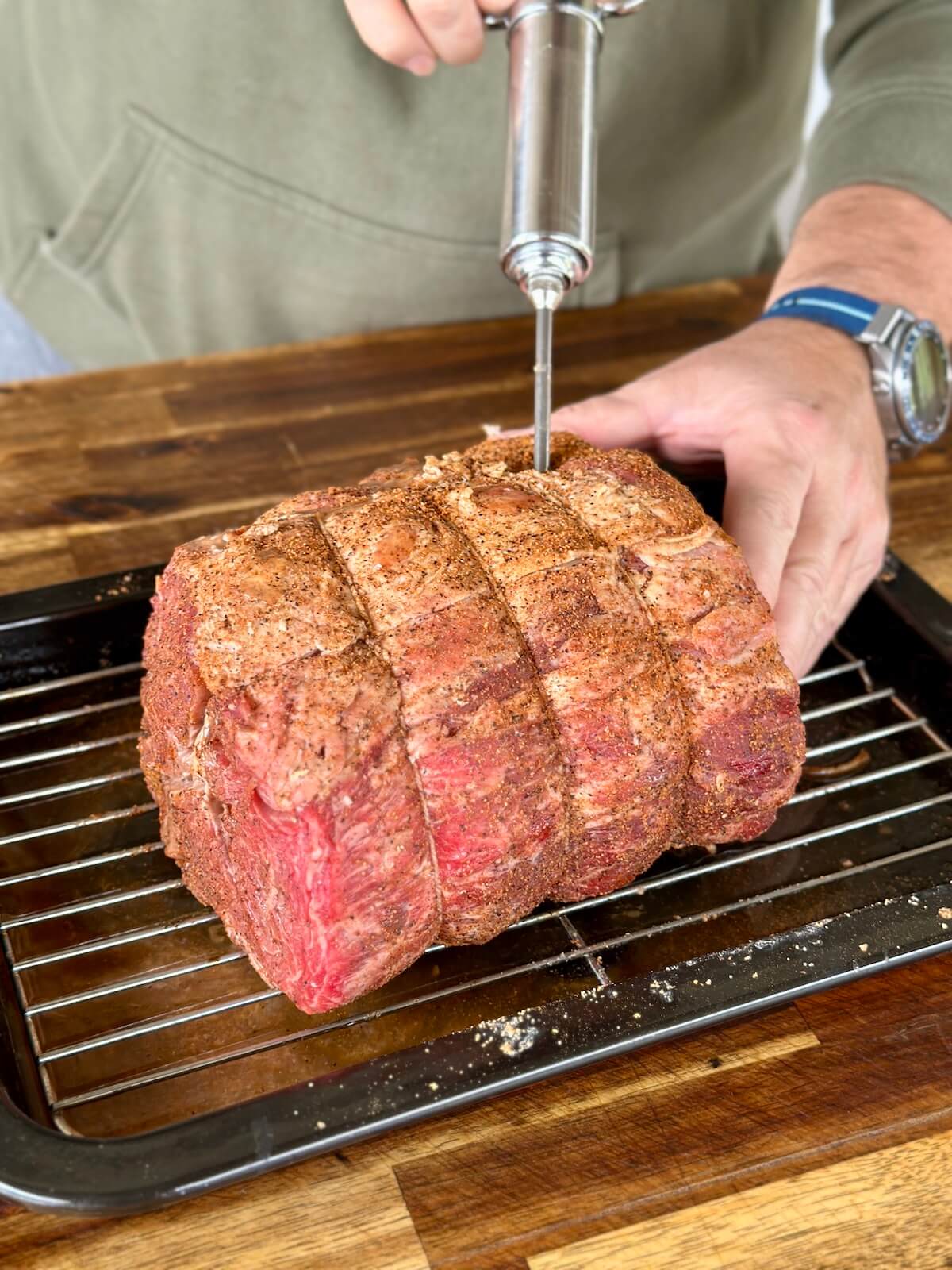injecting a prime rib roast with Cajun butter marinade