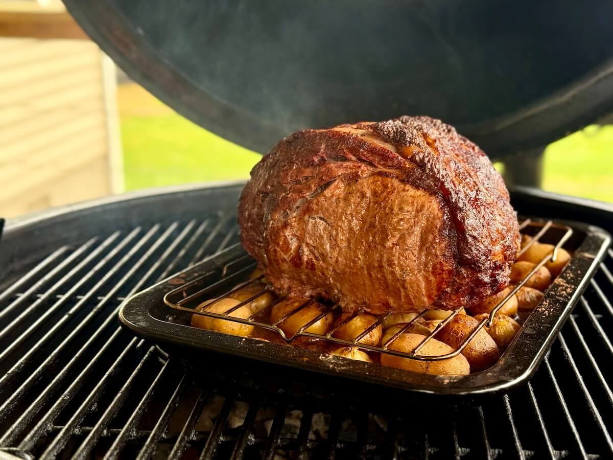 cooking a Cajun prime rib on a charcoal grill
