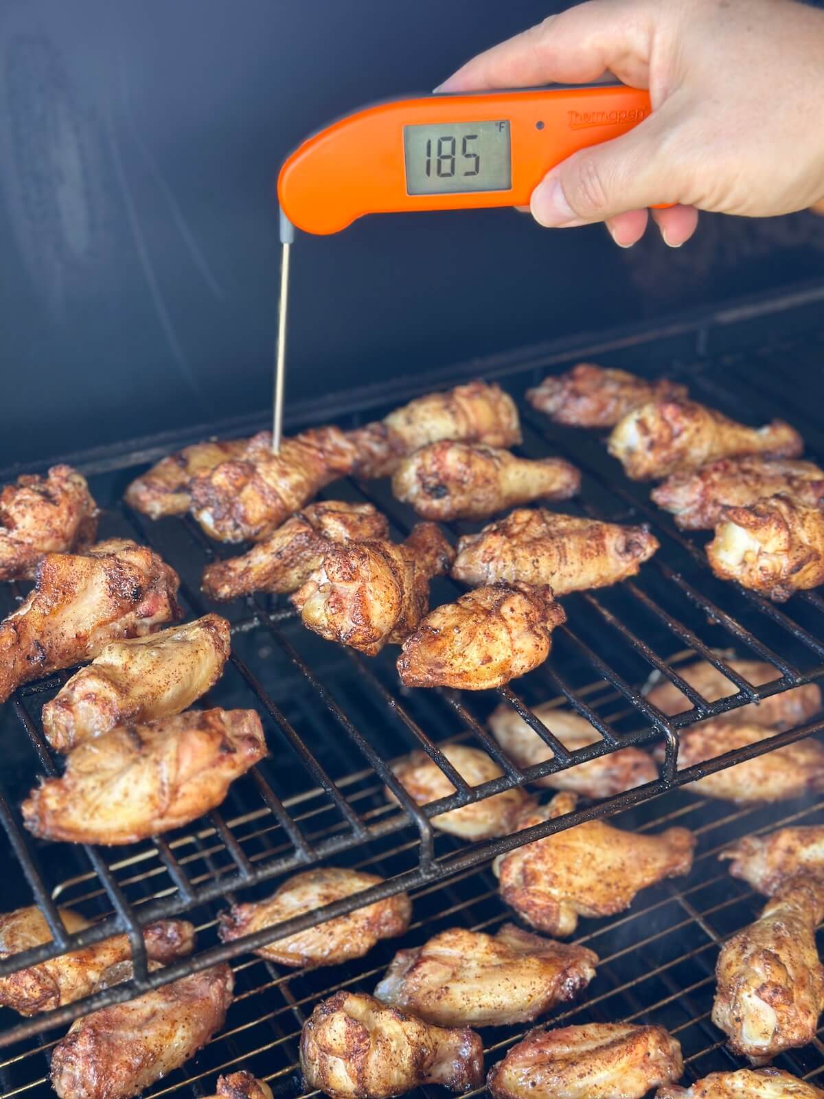 using an instant read meat thermometer to check the internal temp of 0-400 wings