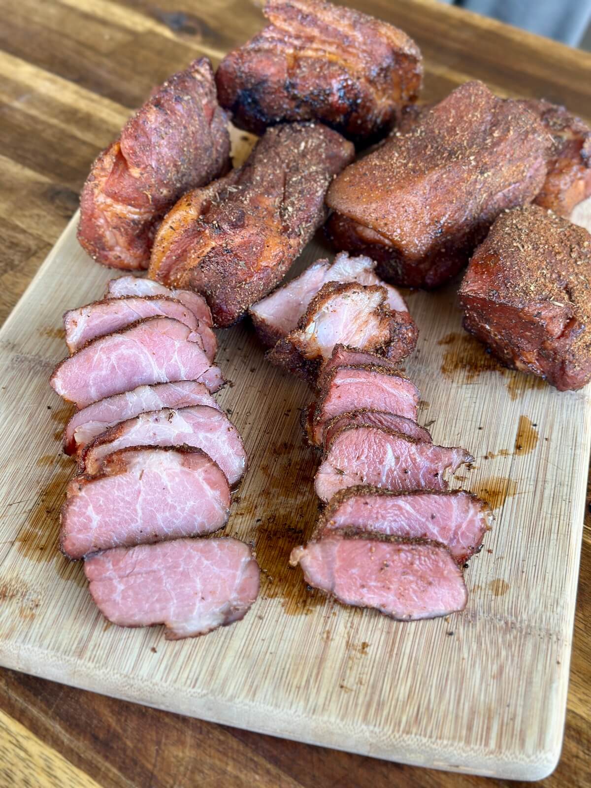 smoked pork tasso sliced on a cutting board