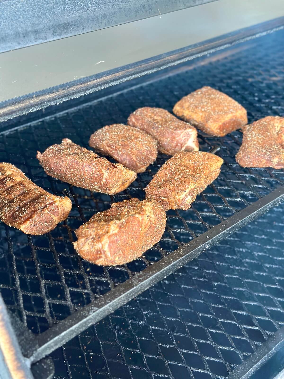 smoking tasso pork on a smoker