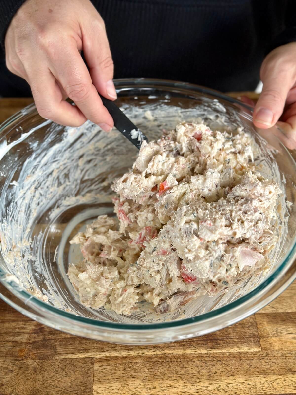 mixing ingredients for crab dip with real crab and imitation crab