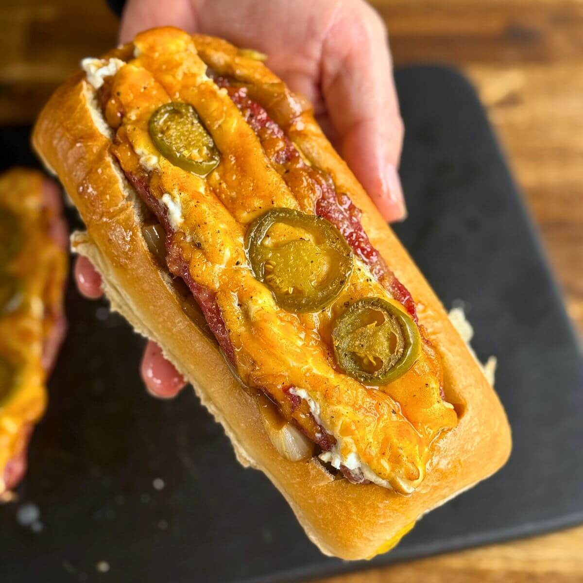 smoked sausage popper boats in a sandwich