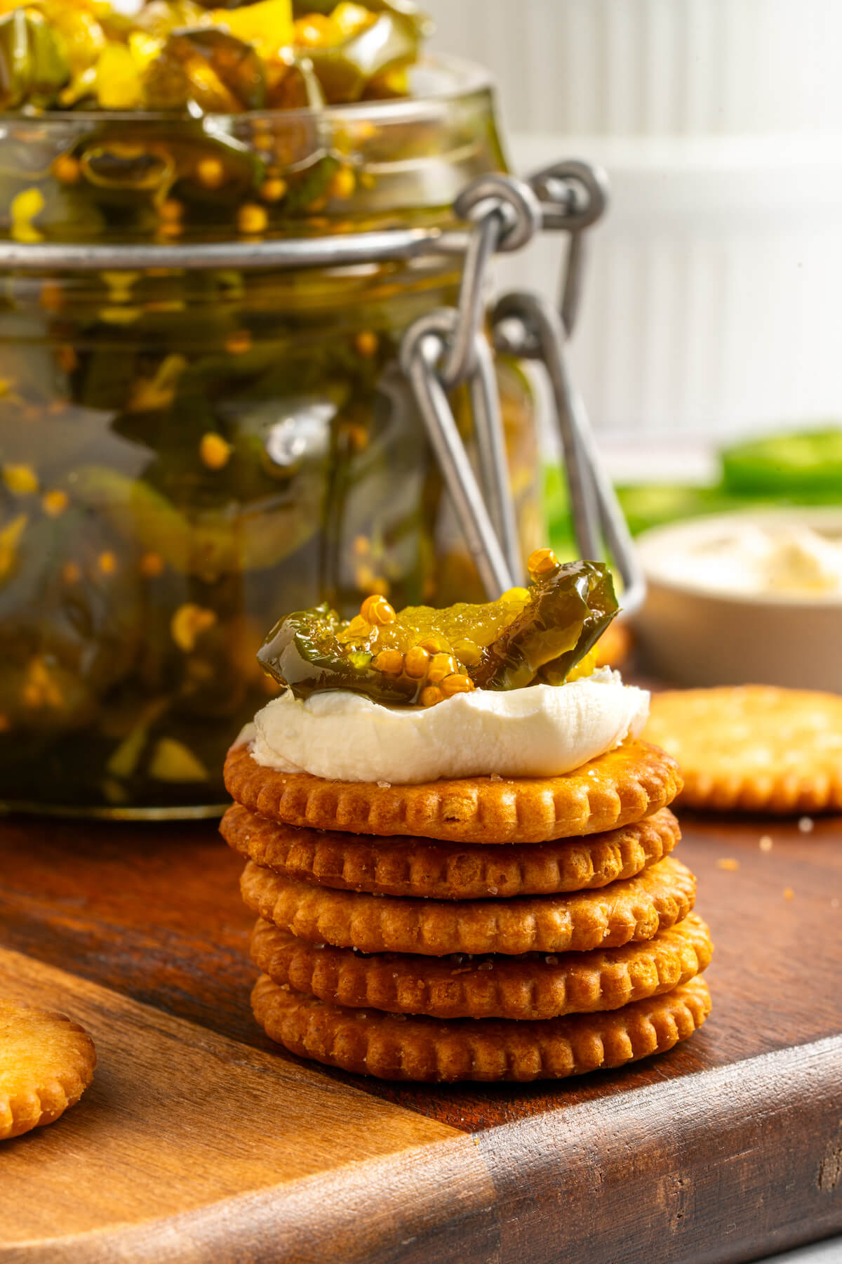 crackers with cream cheese and candied jalapenos