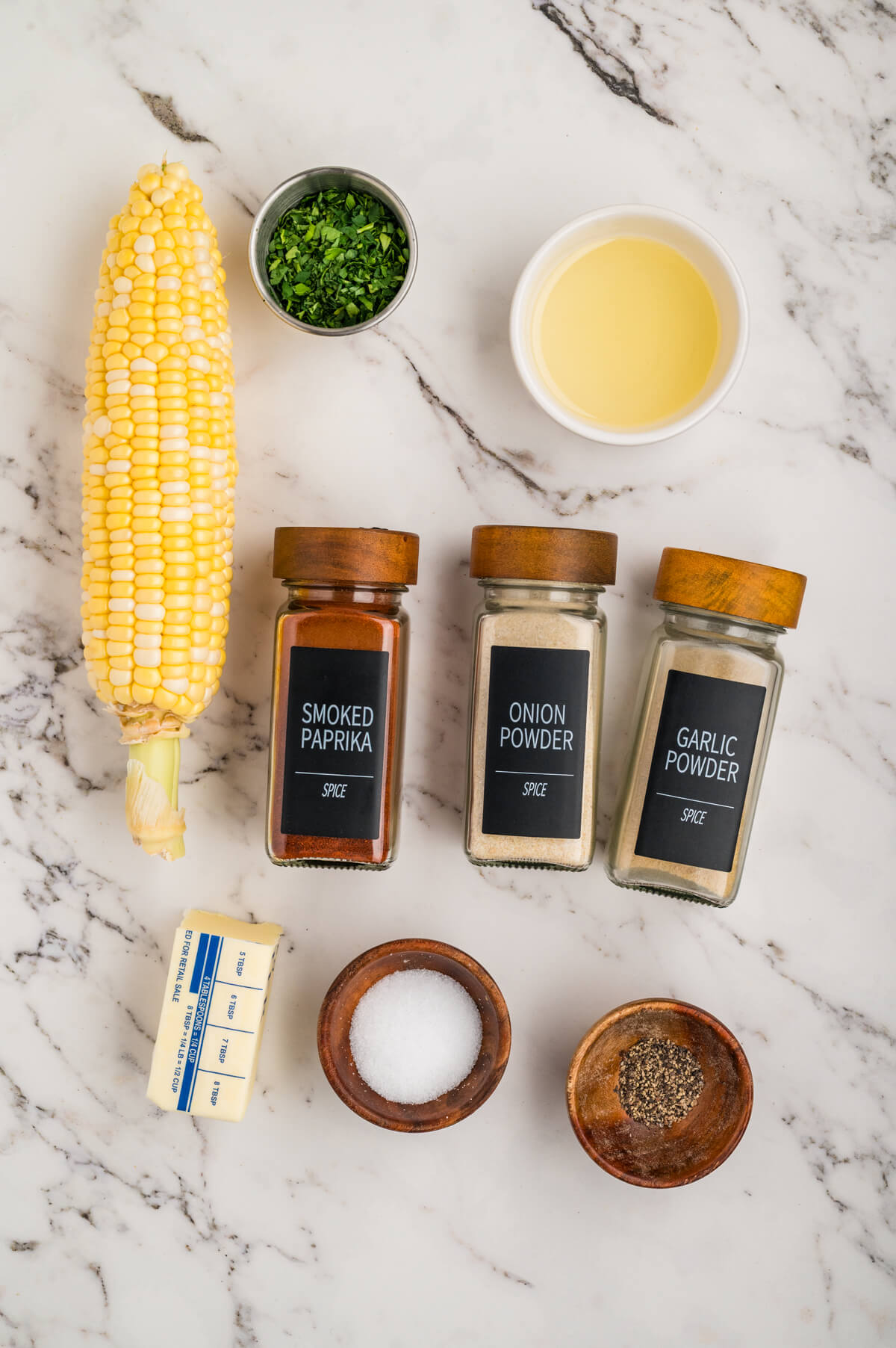 yellow corn on the cob with seasonings and melted butter