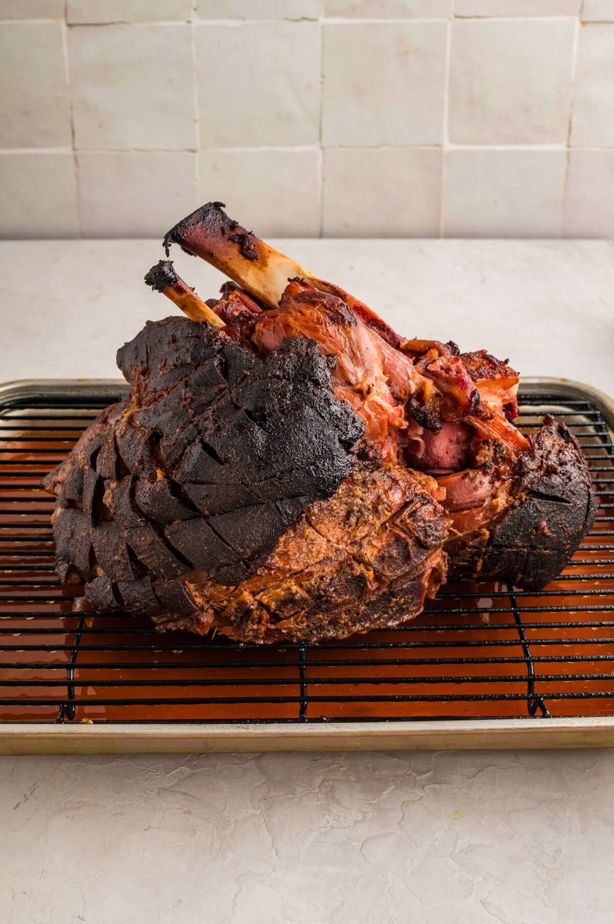 smoked ham on a wire cooling rack