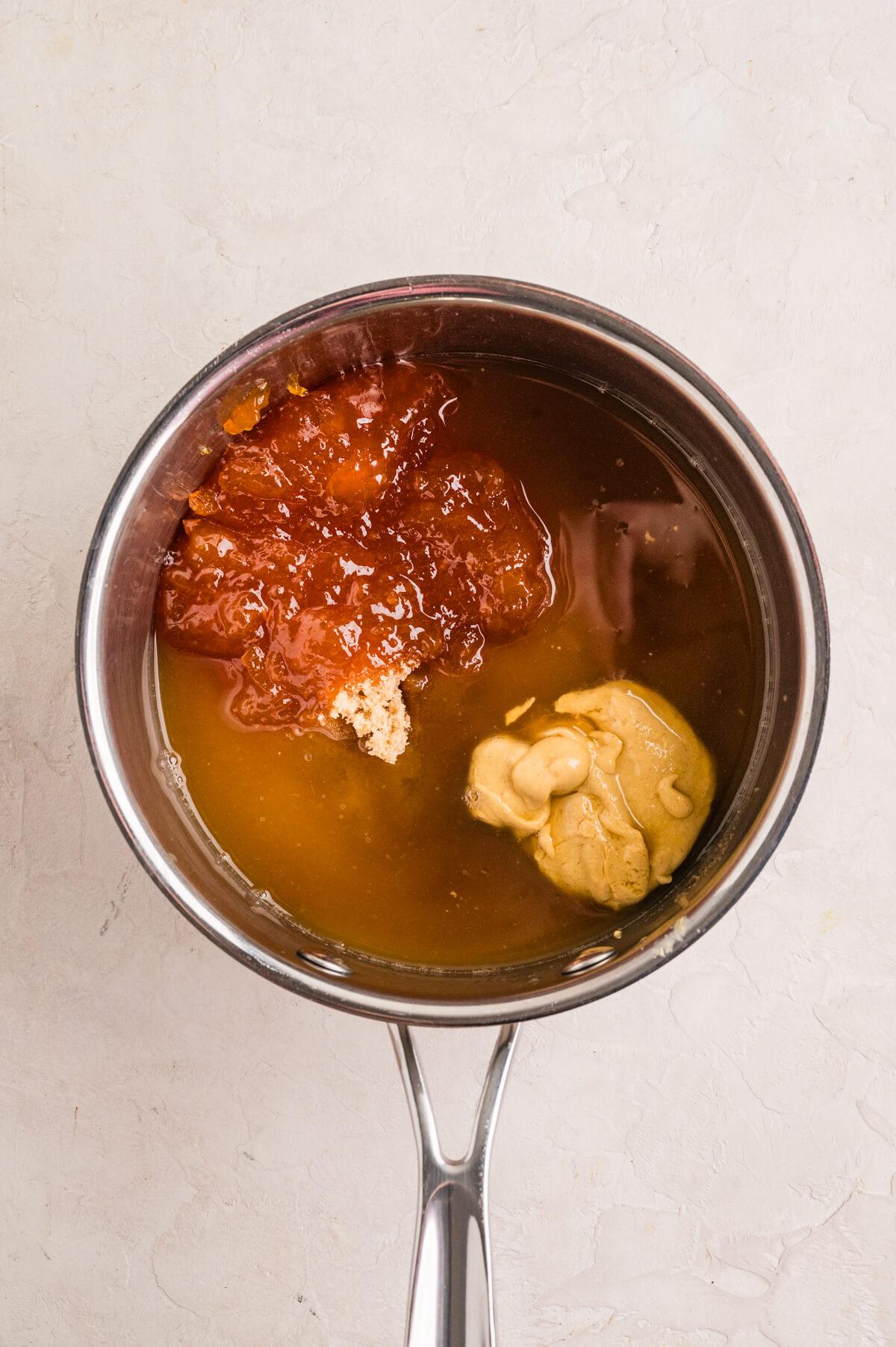 making a ham glaze in a saucepan