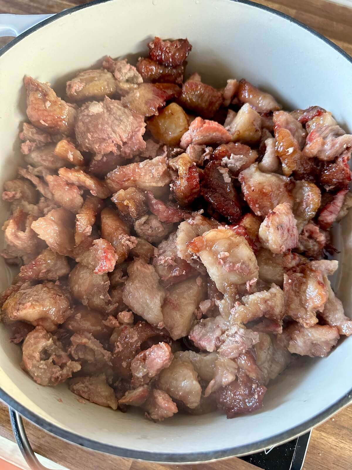 making beef tallow in a pot on the stovetop