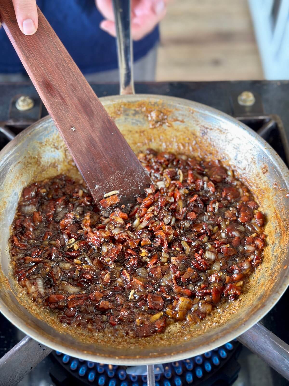 making bacon onion jam in a skillet