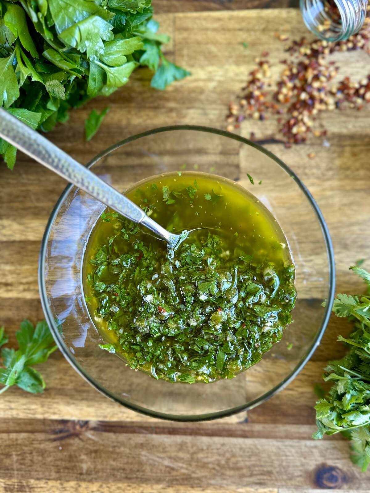 chimichurri in a bowl with cilantro and parsley