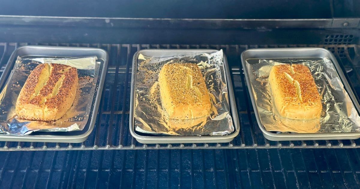 smoking cream cheese on small sheet trays on a Traeger pellet grill