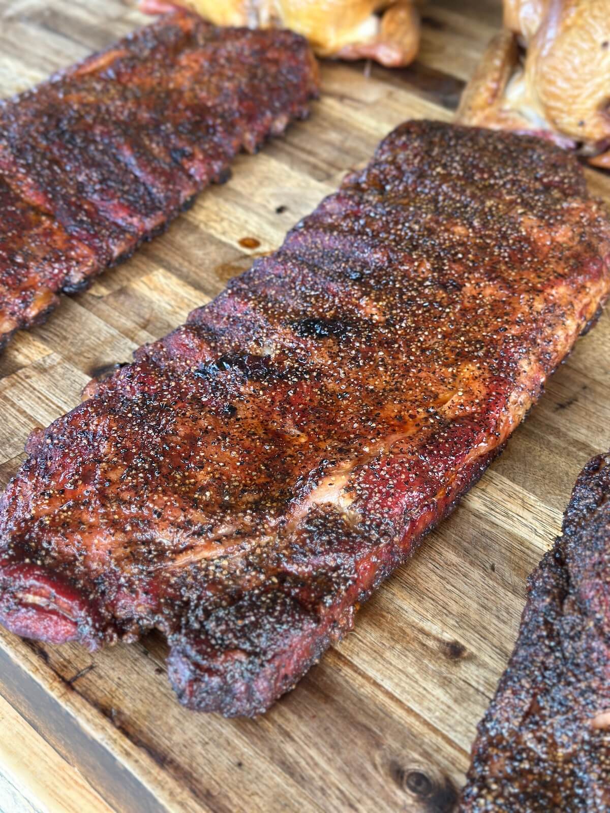 smoked pork ribs on a cutting board