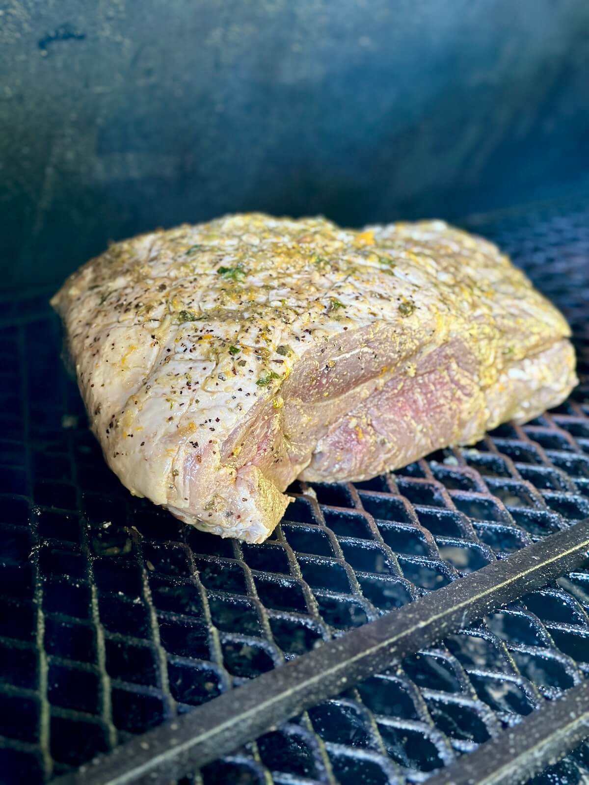 smoking a pork butt with mojo marinade on a pellet grill