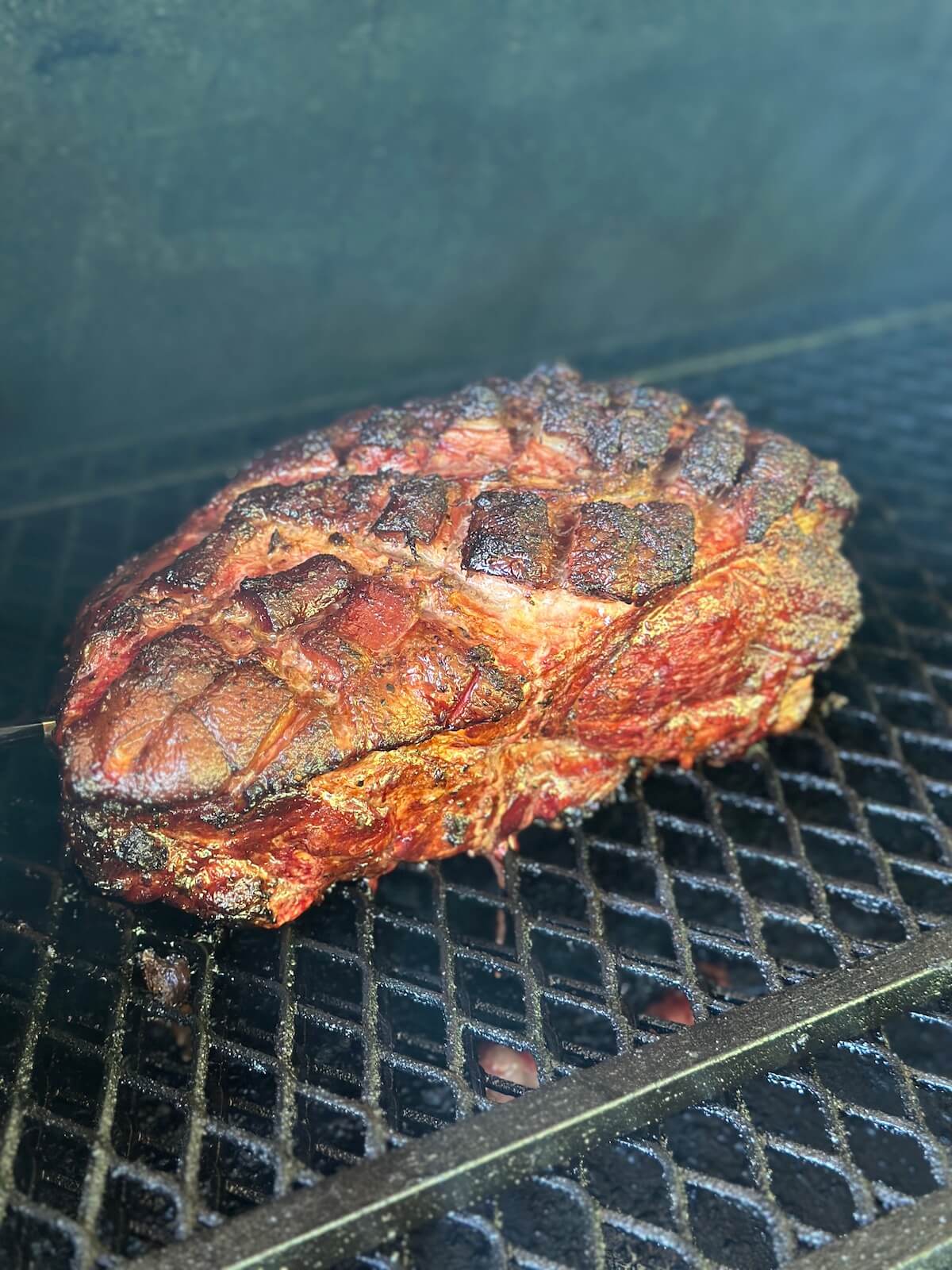 smoked mojo pork butt cooking on a pellet grill