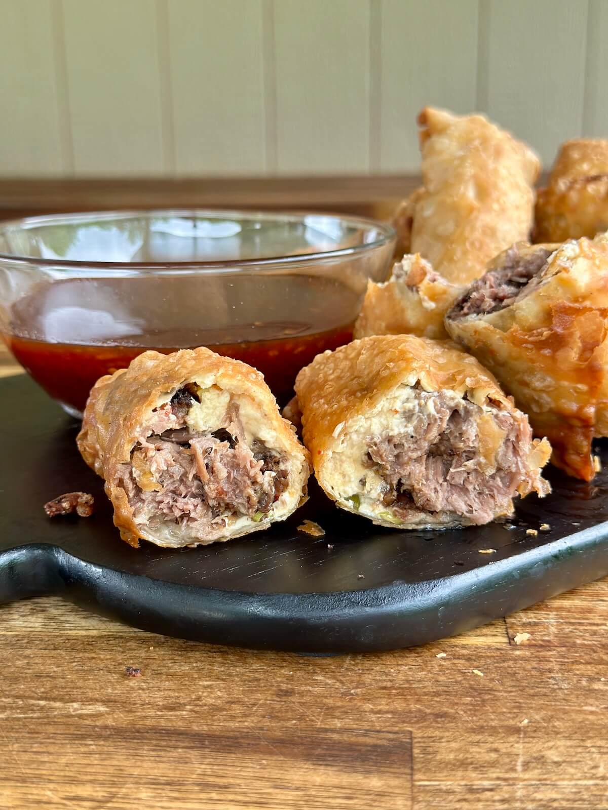brisket egg rolls with BBQ dipping sauce