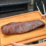 smoked pork belly that looks like ribs on a cutting board