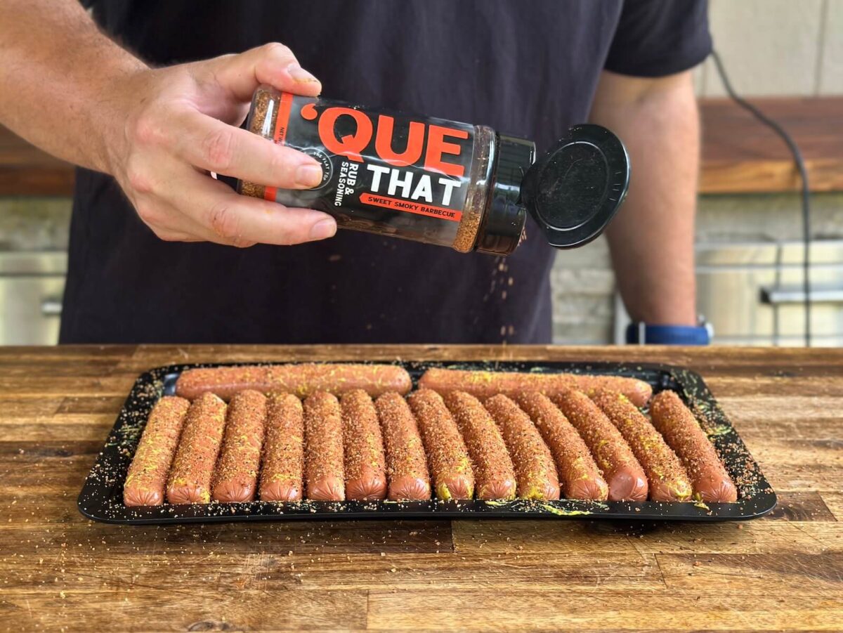 seasoning hot dogs with Que That Barbecue seasoning