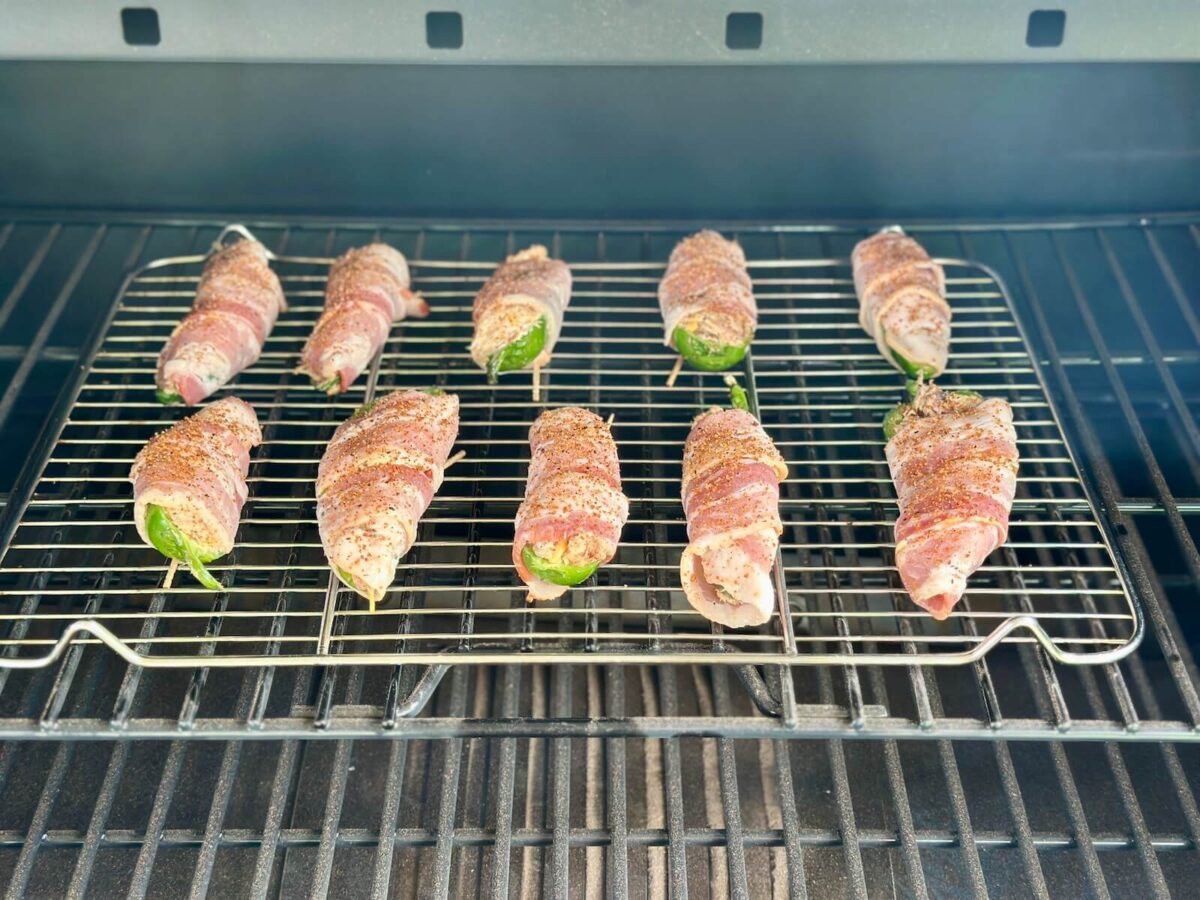 smoking pulled pork stuffed jalalpeno poppers on a pellet grill