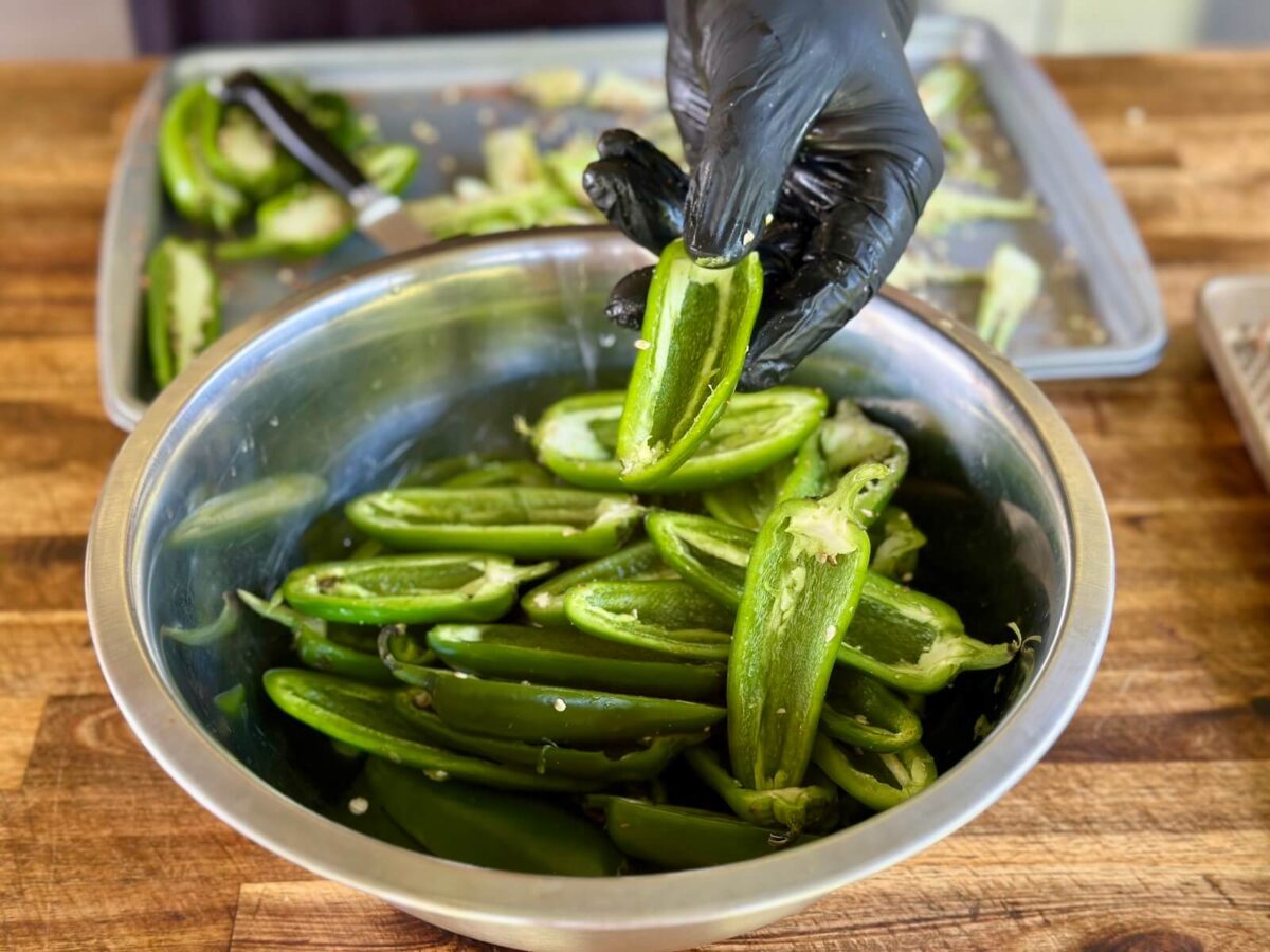fresh jalapenos that have been cut in half and deseeded