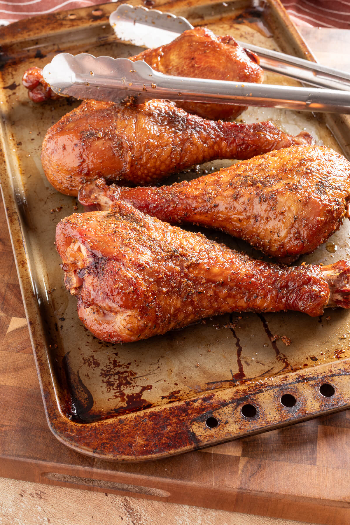 smoked turkey legs on a sheet tray