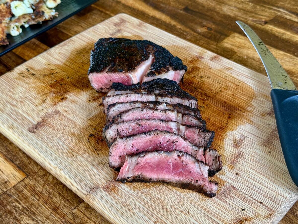 black and blue ribeye steak cooked Pittsburgh style with dark color crust and bright pink rare center
