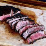 black and blue ribeye steak cooked Pittsburgh style with dark color crust and bright pink rare center