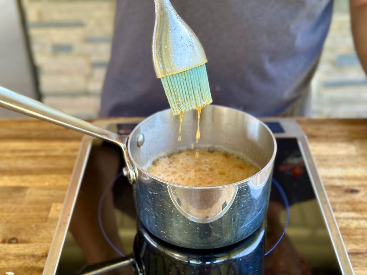 making a honey glaze in a saucepan