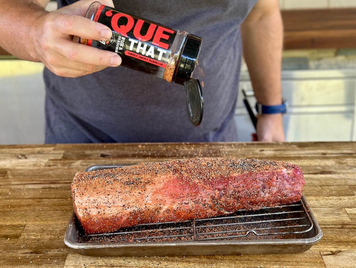 seasoning a pork loin with 'Que That barbecue seasoning