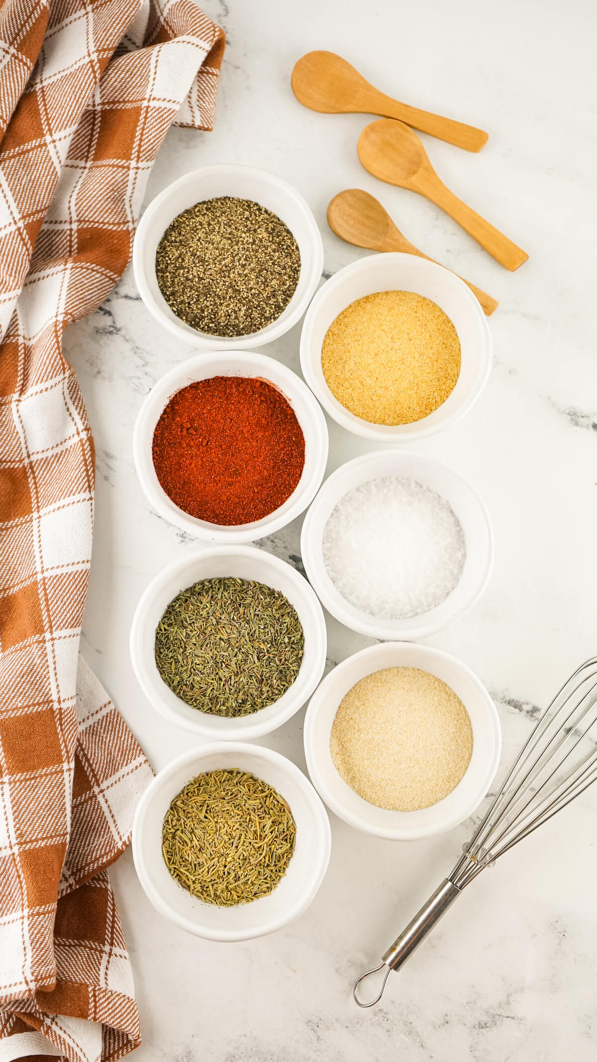 spices measured out in individual bowls