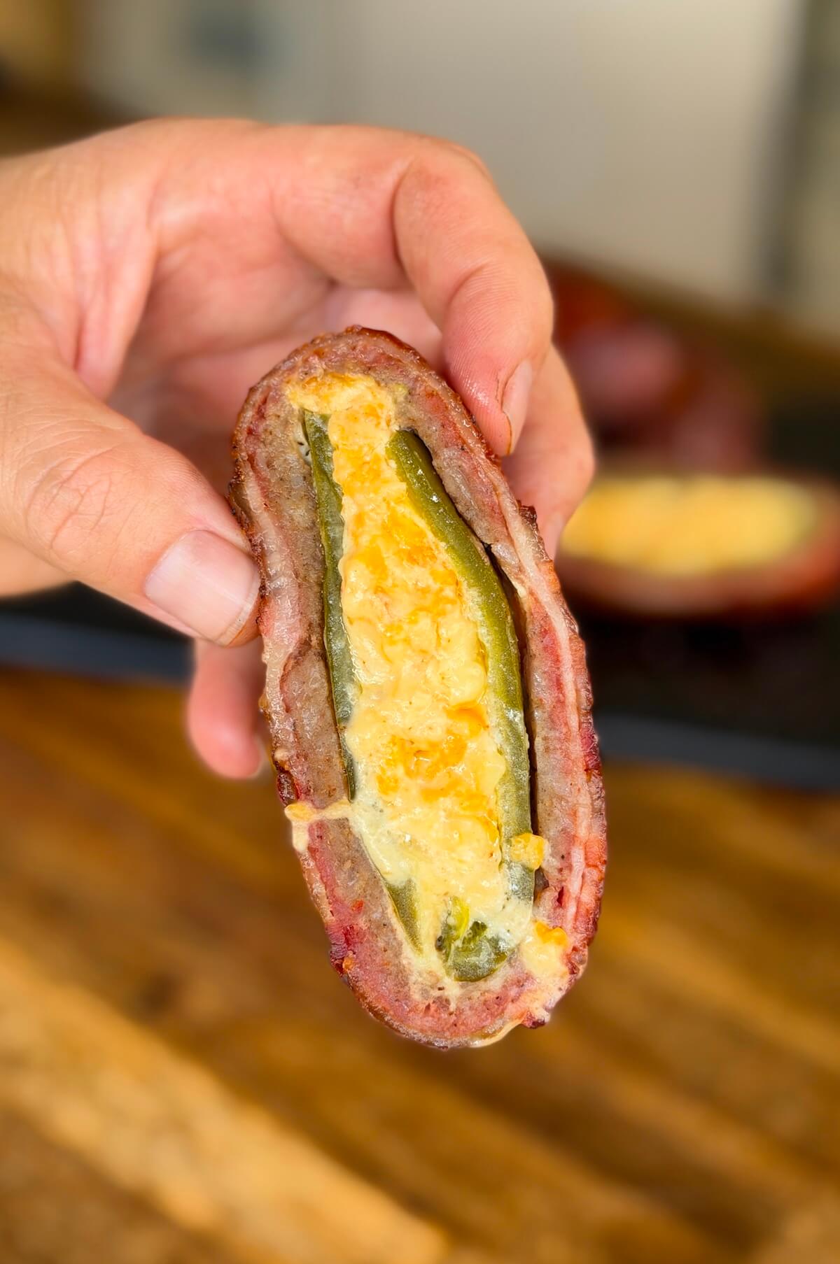 cheese-stuffed armadillo egg cut in half