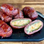 cheese-stuffed armadillo eggs wrapped in bacon and glazed in bbq sauce
