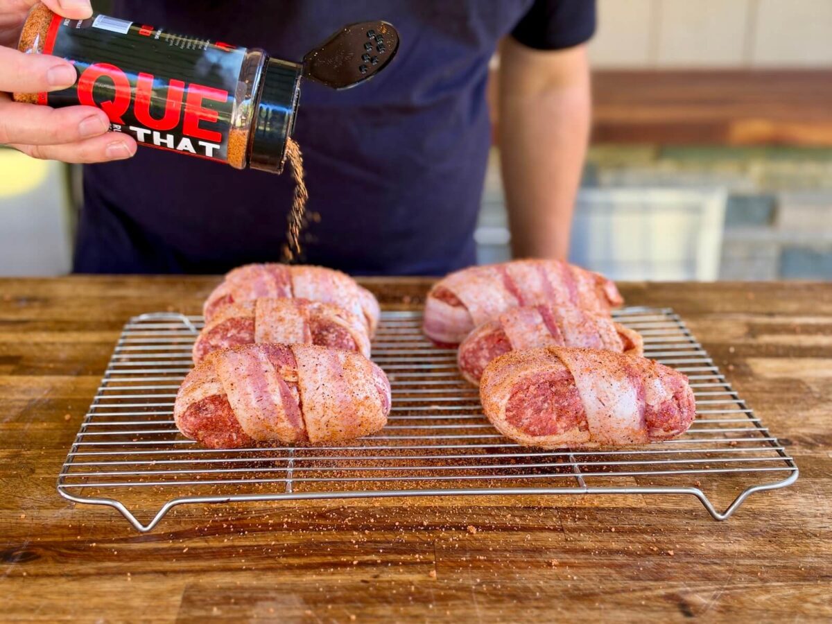 seasoning armadillo eggs with 'Que That barbecue seasoning