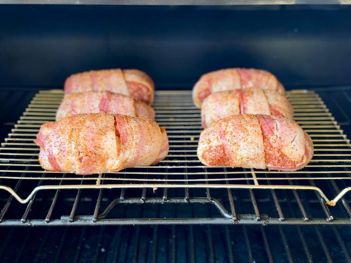 smoking bacon wrapped armadillo eggs on a pellet grill